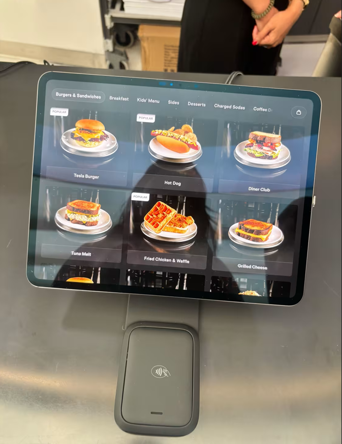 Tesla Diner by Elon Musk Excitingly Opens in LA: Retro Vibes, Movie Screens & High-Tech Robot Servers